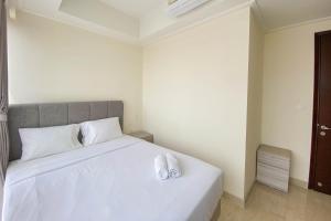 Nice and Minimalist 2BR at Menteng Park Apartment