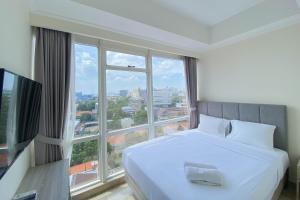 Nice and Minimalist 2BR at Menteng Park Apartment