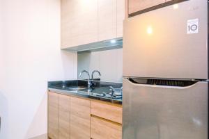 Best Homey and Nice 1BR at Ciputra World 2 Apartment By Travelio