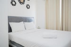 Strategic and Homey 2BR at Puri Garden Apartment near Mall By Travelio