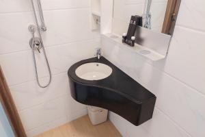 Studio Room with Comfortable Design at Sky House BSD Apartment By Travelio