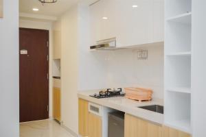 Cozy Studio Room at Sky House BSD Apartment By Travelio