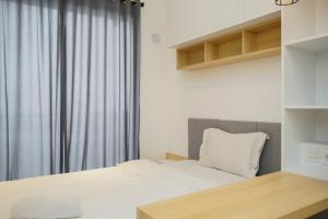 Cozy Studio Room at Sky House BSD Apartment By Travelio