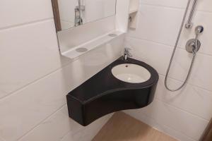 Cozy Studio Room at Sky House BSD Apartment By Travelio