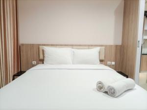 Elegant and Comfortable Studio Patraland Amarta Apartment By Travelio