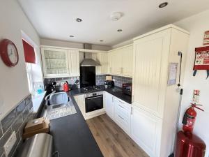 East Bay Cottage - Part of the The Bay Filey Holiday Village with pool, gym and direct beach access, pub, restaurant, tennis and meadows walks