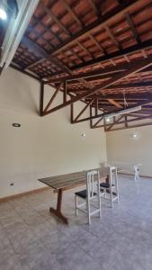 Casa na praia a 450 metros do mar com piscina, garagem e churrasqueira