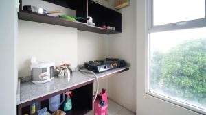 Homey and Comfy 2BR at Dian Regency Apartment By Travelio