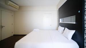 Spacious and Strategic 2BR Apartment at Trillium Residence By Travelio