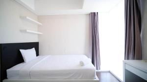 Spacious and Strategic 2BR Apartment at Trillium Residence By Travelio