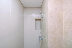 Nice and Comfort 2BR Apartment at Transpark Cibubur By Travelio