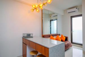 Nice and Comfort 2BR Apartment at Transpark Cibubur By Travelio