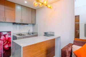 Nice and Comfort 2BR Apartment at Transpark Cibubur By Travelio