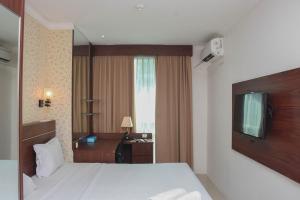 Great Location and Comfy 1BR Apartment at Woodland Park Residence By Travelio