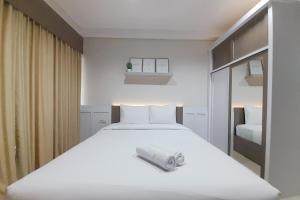 Cozy Studio Room at Patraland Amarta Apartment By Travelio