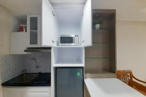 Cozy Studio Room at Patraland Amarta Apartment By Travelio