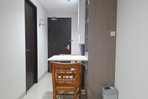 Cozy Studio Room at Patraland Amarta Apartment By Travelio