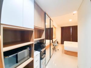 Cozy Designed Studio at Patraland Amarta Apartment By Travelio