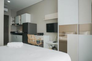 Modern and Comfort Studio at Ciputra International Apartment By Travelio