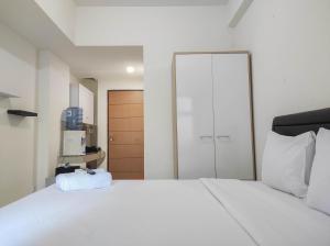 Nice and Cozy Studio at Vida View Makassar Apartment By Travelio
