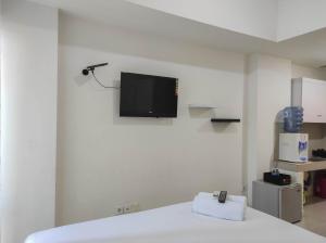 Nice and Cozy Studio at Vida View Makassar Apartment By Travelio
