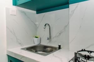 Nice and Simply Studio at Amazana Serpong Apartment By Travelio