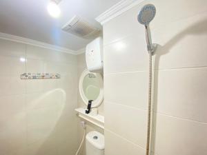 Well Furnished Studio Room at Grand Asia Afrika Apartment By Travelio