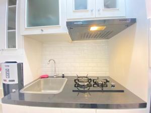 Well Furnished Studio Room at Grand Asia Afrika Apartment By Travelio