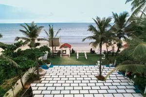 Nasya's Beach Side Cottages - Orlim