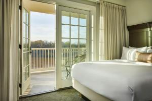 King Room with Balcony and River View room in St James Hotel Selma Tapestry Collection by Hilton