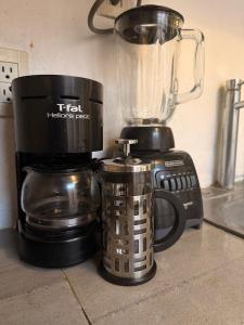 Casita de la 12 5 min a centro Campeche ideal para 2 ó 3 personas Cocina con estufa de inducción, microondas y refrigerador