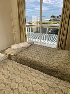 Lindo apartamento de frente para o mar