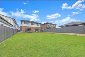 Center of Rouse Hill house with back yd