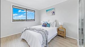 Center of Rouse Hill house with back yd