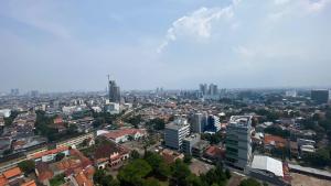Nice and Elegant 2BR at 26th Floor Menteng Park Apartment By Travelio
