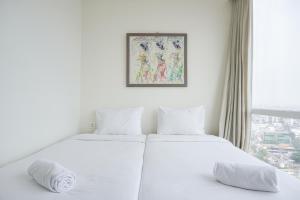 Nice and Elegant 2BR at 26th Floor Menteng Park Apartment By Travelio