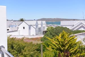 Pelican Cove is a Modern 4-Bedroom Holiday Home in Langebaan with some Sea Views