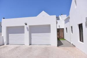 Pelican Cove is a Modern 4-Bedroom Holiday Home in Langebaan with some Sea Views