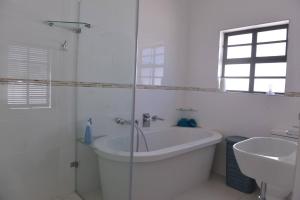 Pelican Cove is a Modern 4-Bedroom Holiday Home in Langebaan with some Sea Views