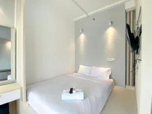 Homey and Elegant Studio Vasanta Innopark Apartment By Travelio - Cibuntu