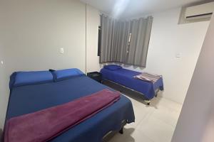 Para 10 pessoas, 03 quartos ar condicionado e ventilador, garagem, atrás do hospital da Unimed apt 302