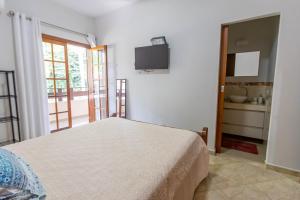 Casa em condomínio com piscina, Wi-Fi e garagem