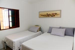 Casa perto das principais praias c WiFi e churrasq