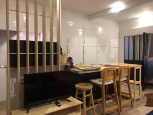 Appartements Les alpages - lit queen size - centre station : photos des chambres