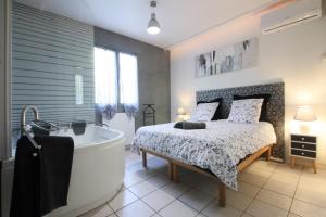 Villas Magnifique villa avec piscine : photos des chambres