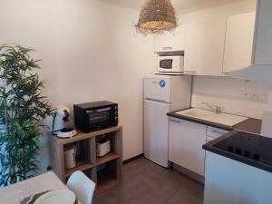 Appartements L'Olivier - Piscine et climatisation : photos des chambres