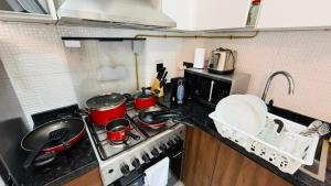 Lawnz Luxury furnished studio with Balcony Swimming Pool Gym Kids play ground