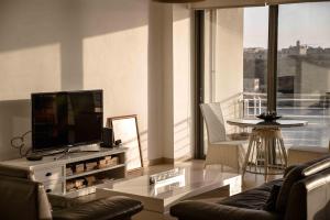 Seafront condo with a view of Valletta