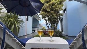 Conforto e Diversão para Toda a Família 50m da Praia - churrasqueira - Sinuca - Jardim - vista lateral para o mar