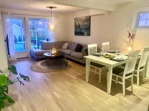 Super fresh appartement with garden WIFI EV Carger - Melsomvik